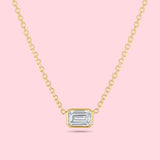 1 carat emerald cut diamond bezel