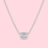 1 carat emerald cut diamond bezel